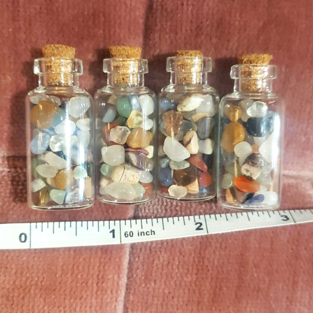 Mixed gemstones in bottles